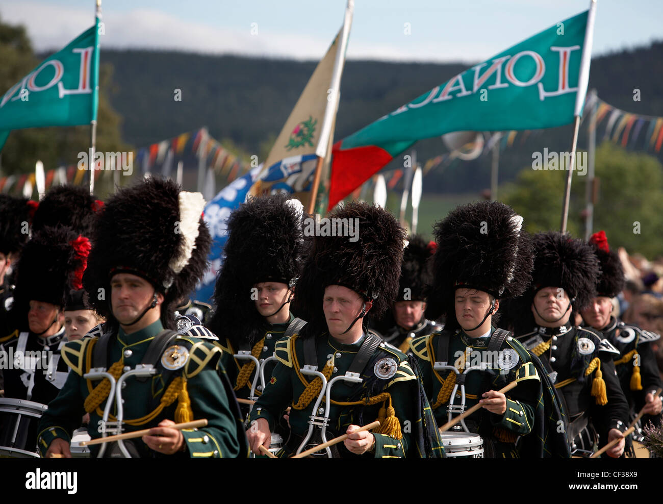 A marching drum band performing at the Lonach Highland Games Stock