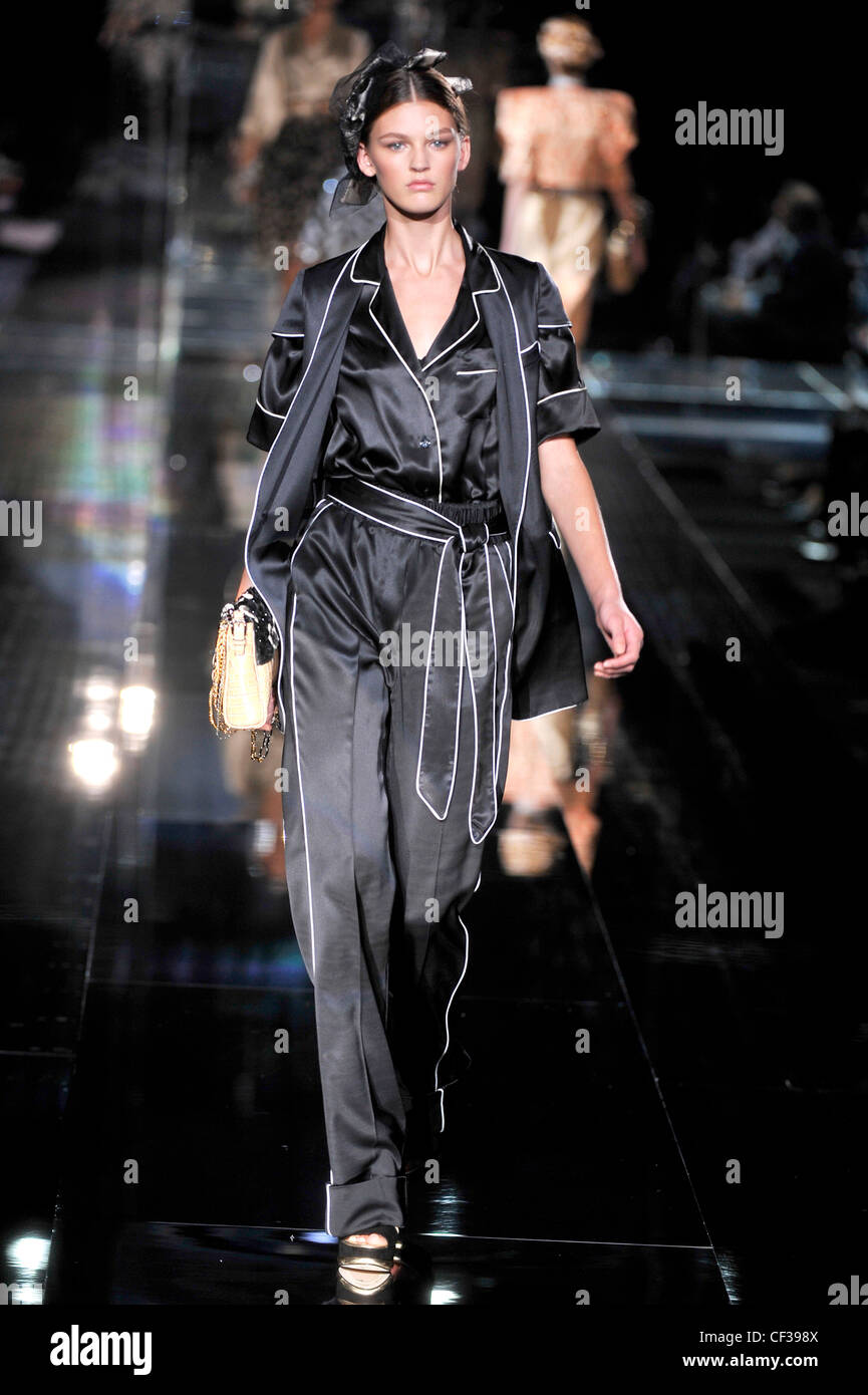 Dolce & Gabbana Milan Ready to Wear Spring Summer Monochrome pyjama style black satin jumpsuit and jacket Stock Photo