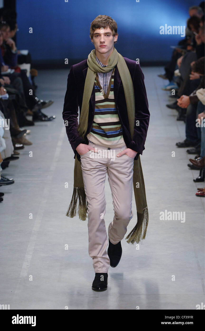 Burberry Menswear Milan A W Blonde male model wearing an aubergine coloured  velvet blazer over a horizontally striped V neck Stock Photo - Alamy