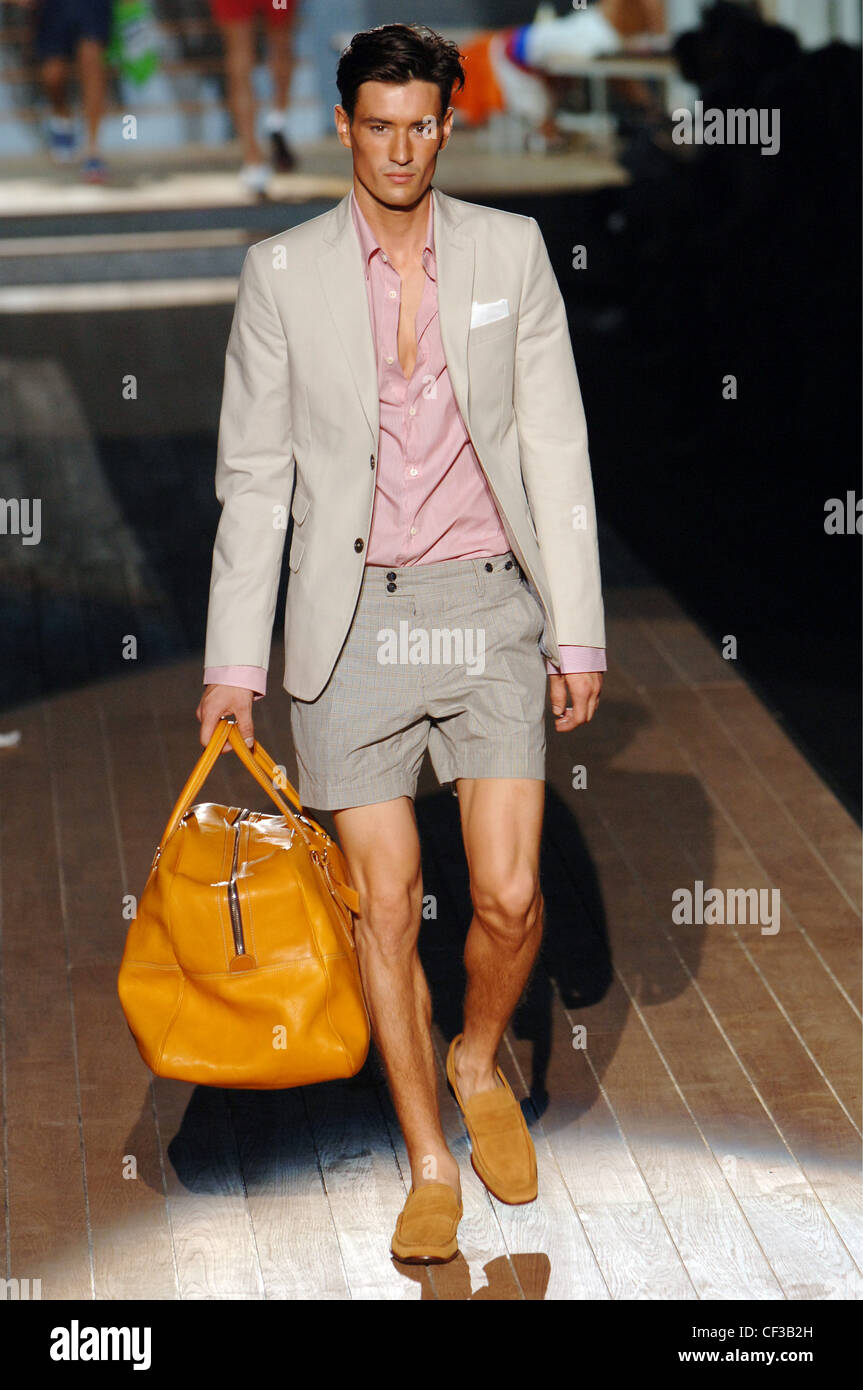 Dsquared Milan Ready to Wear Menswear Spring Summer Brunette male model  walking on the runway wearing a pink button down shirt Stock Photo - Alamy