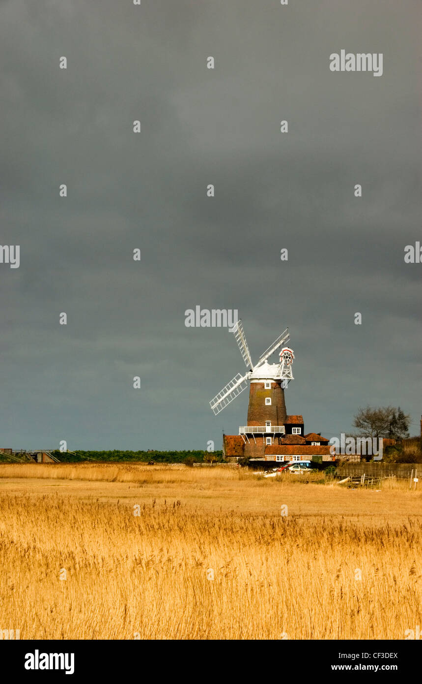 A view over a field to Cley Windmill. The windmill featured in MGM's 1949 film 'Conspirator' with Elizabeth Taylor and was the s Stock Photo