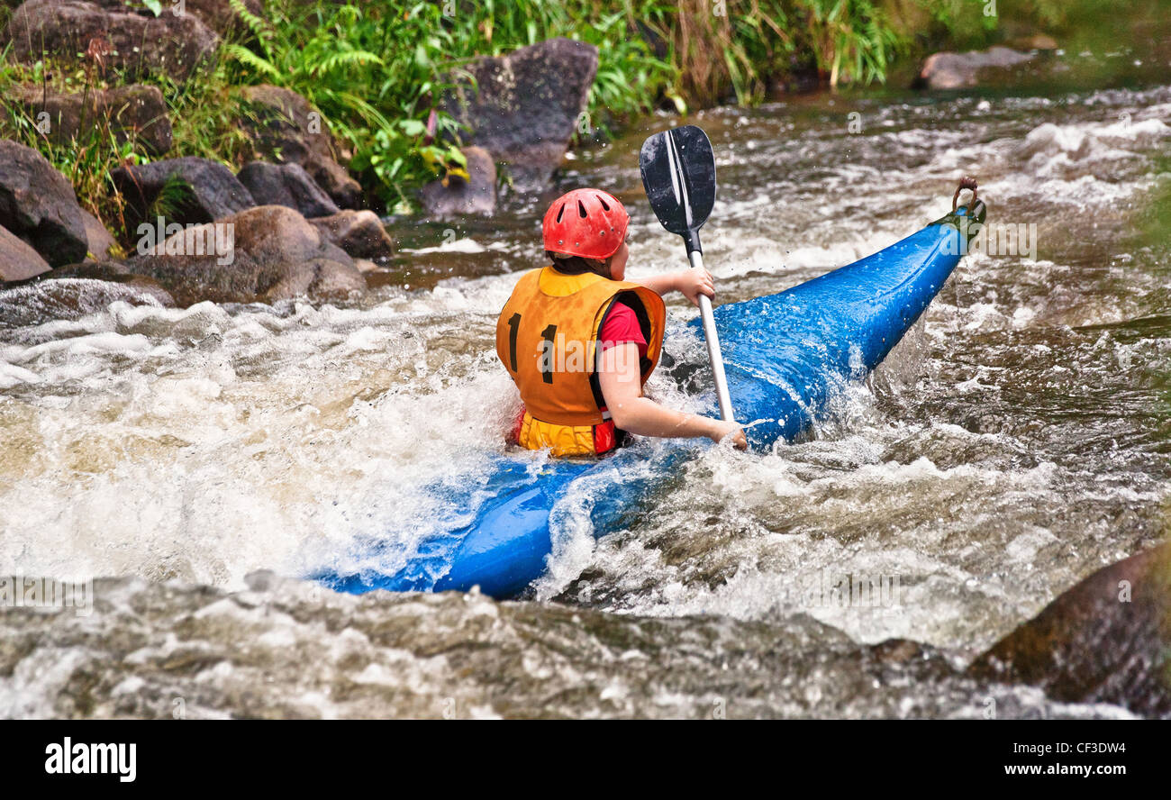 teenager white water kayaking in the rapids Stock Photo Alamy