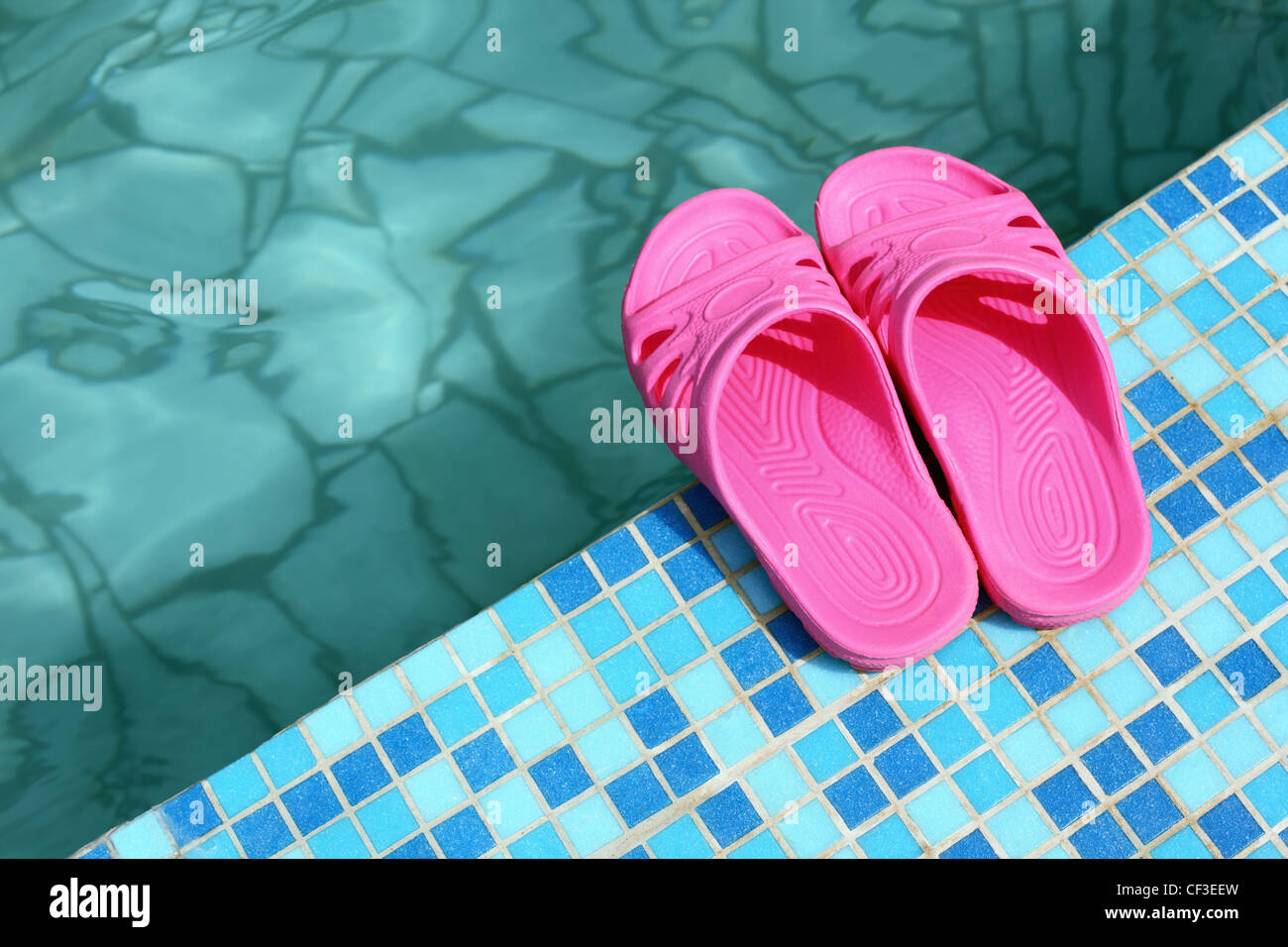 Beach slippers on pool side Stock Photo