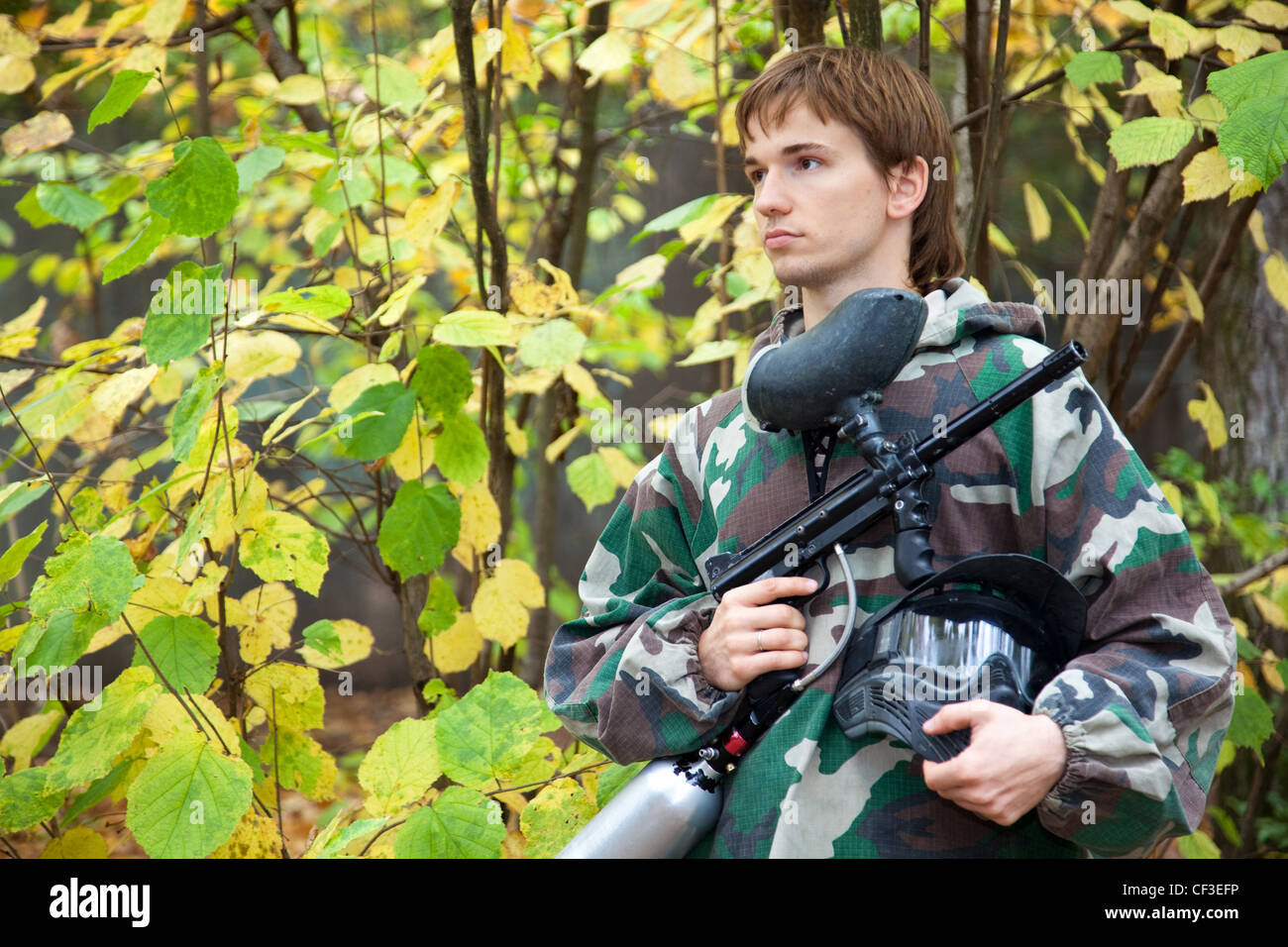 paintball player looks aside Stock Photo