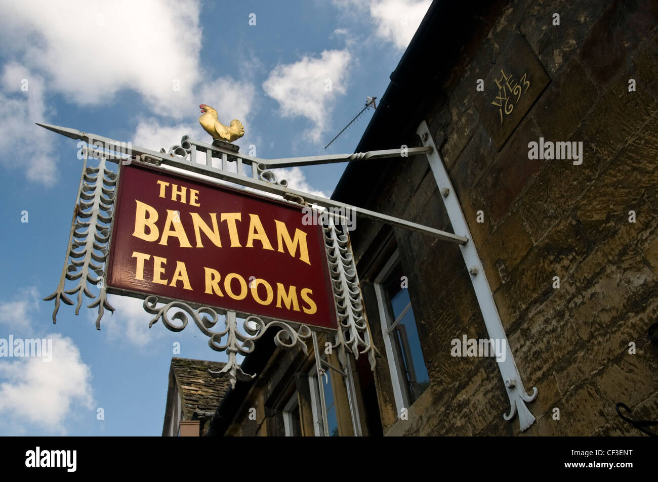 Looking up at a traditional tea room sign in the streets of Chipping Camden. Stock Photo