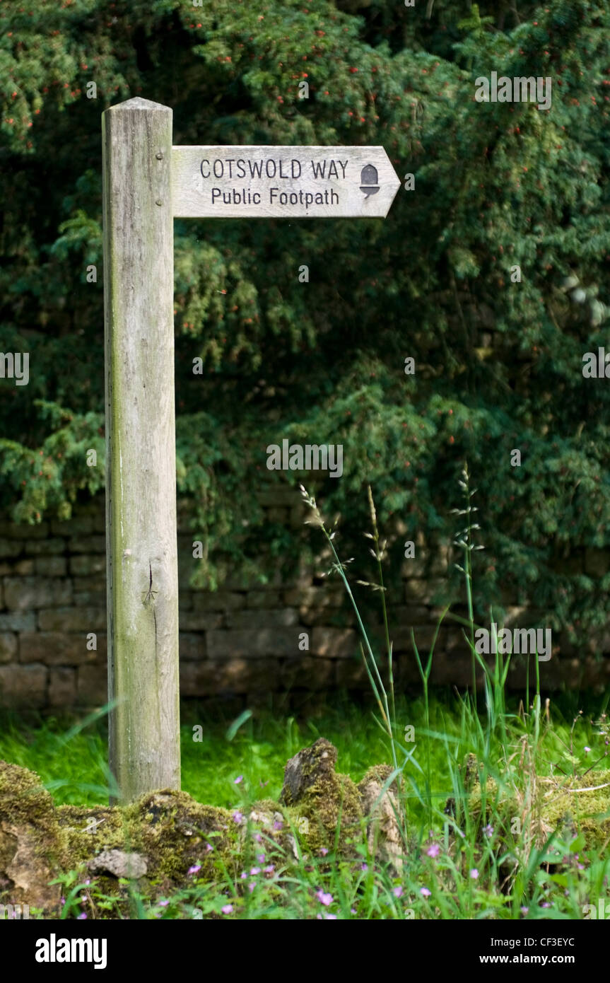 A wooden sign post for the Cotswold Way in Bibury. Stock Photo