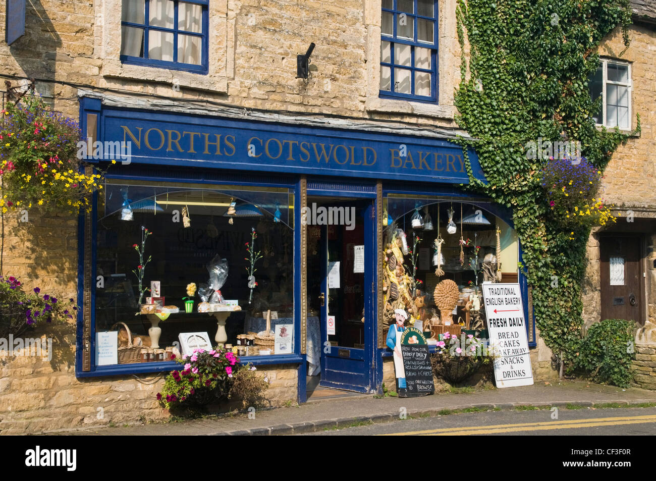 The shop front of a traditional local bakery at Burton on the Water. Stock Photo