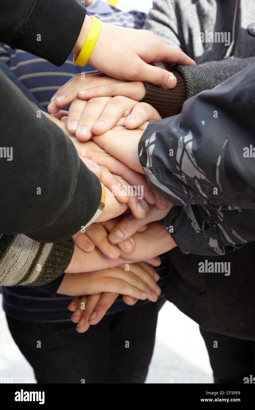 hands of teens together. union Stock Photo - Alamy