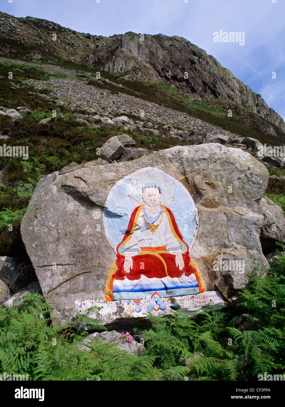 Rock painting of Marpa the Translator, founder of the Kargyupa (Kargyutpa) sect of Tibetan Buddhism which is based on enlightenm Stock Photo