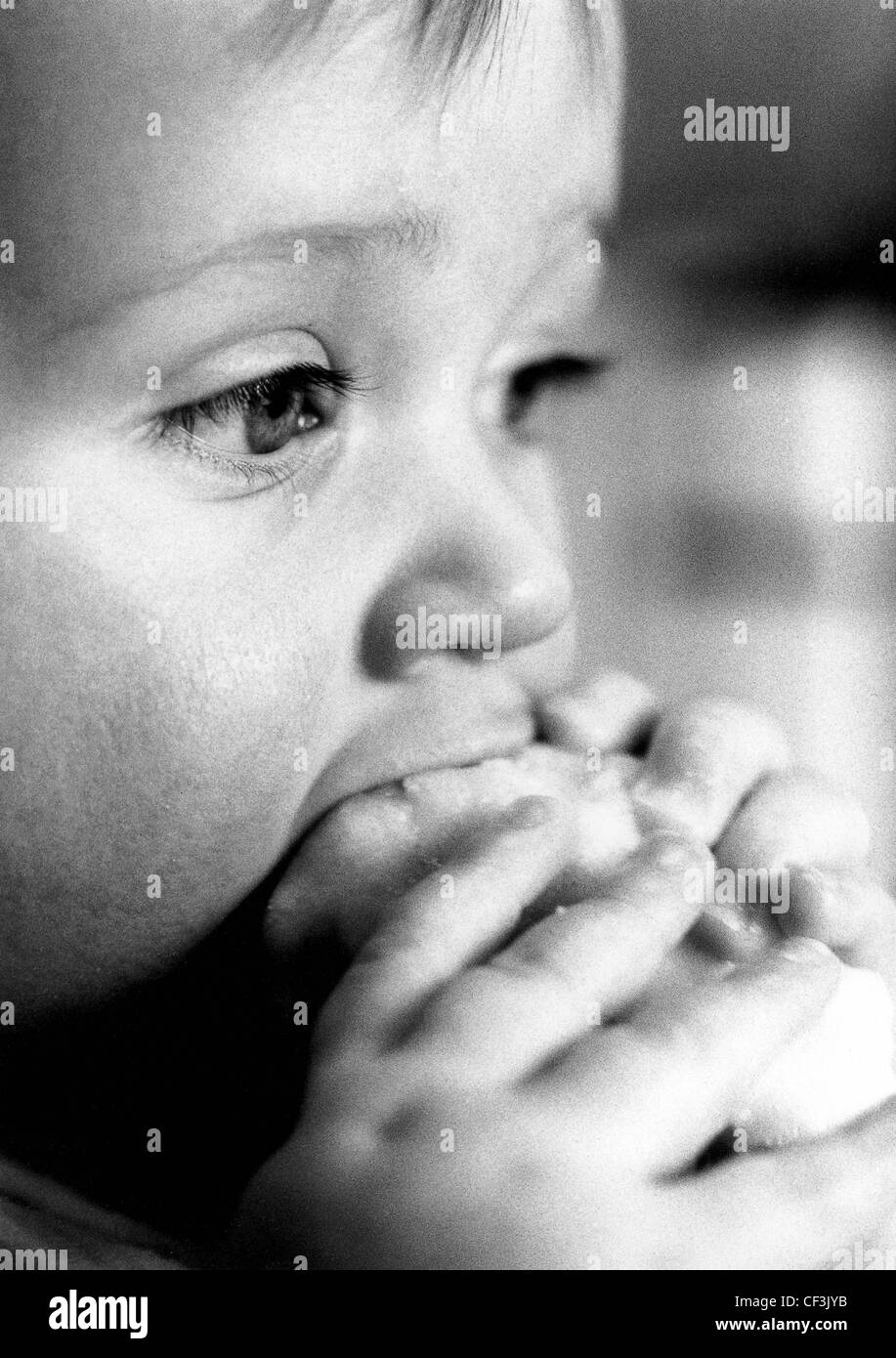Child eating with hands Black and White Stock Photos & Images Alamy