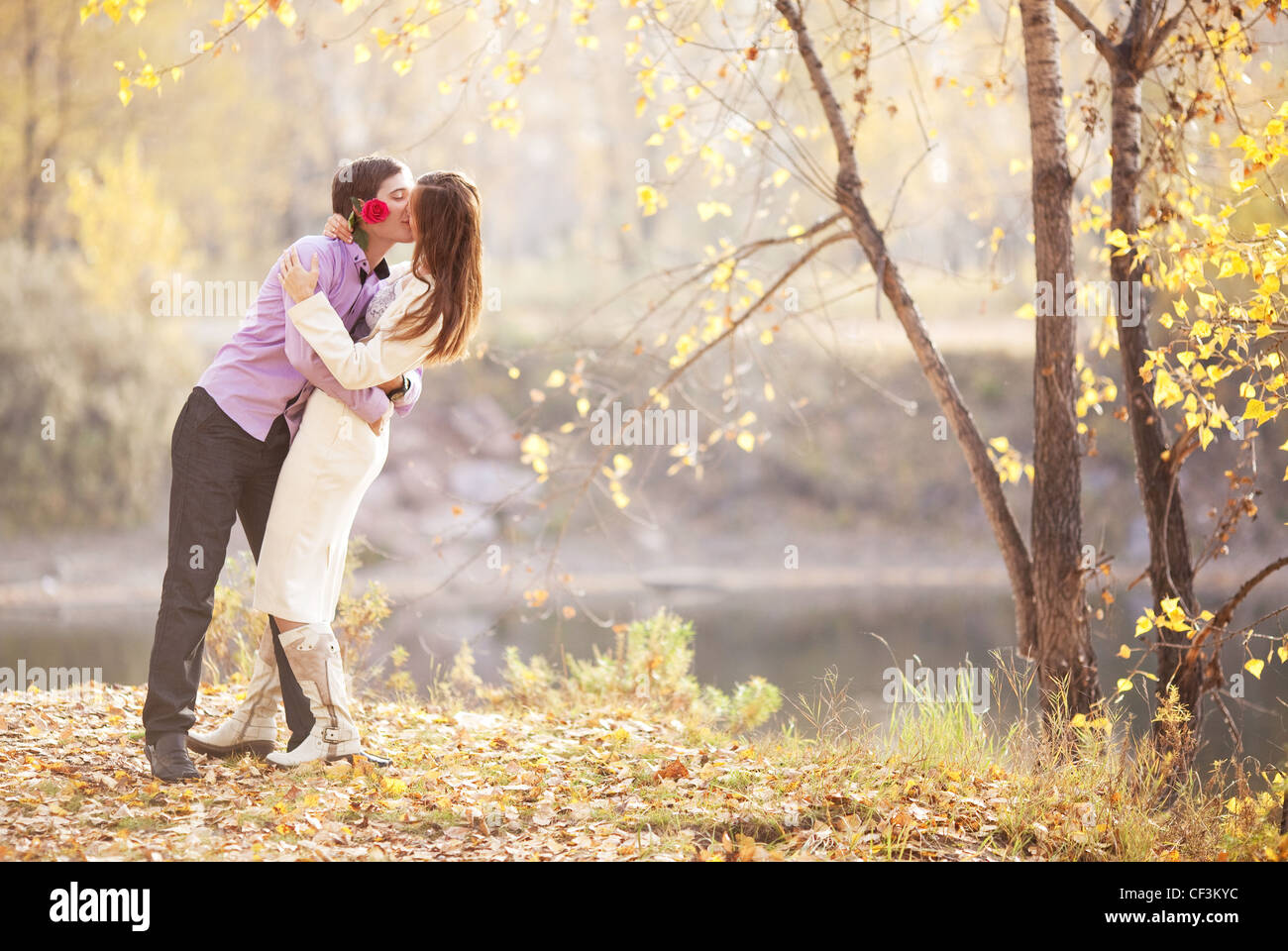 happy young couple in the park Stock Photo - Alamy
