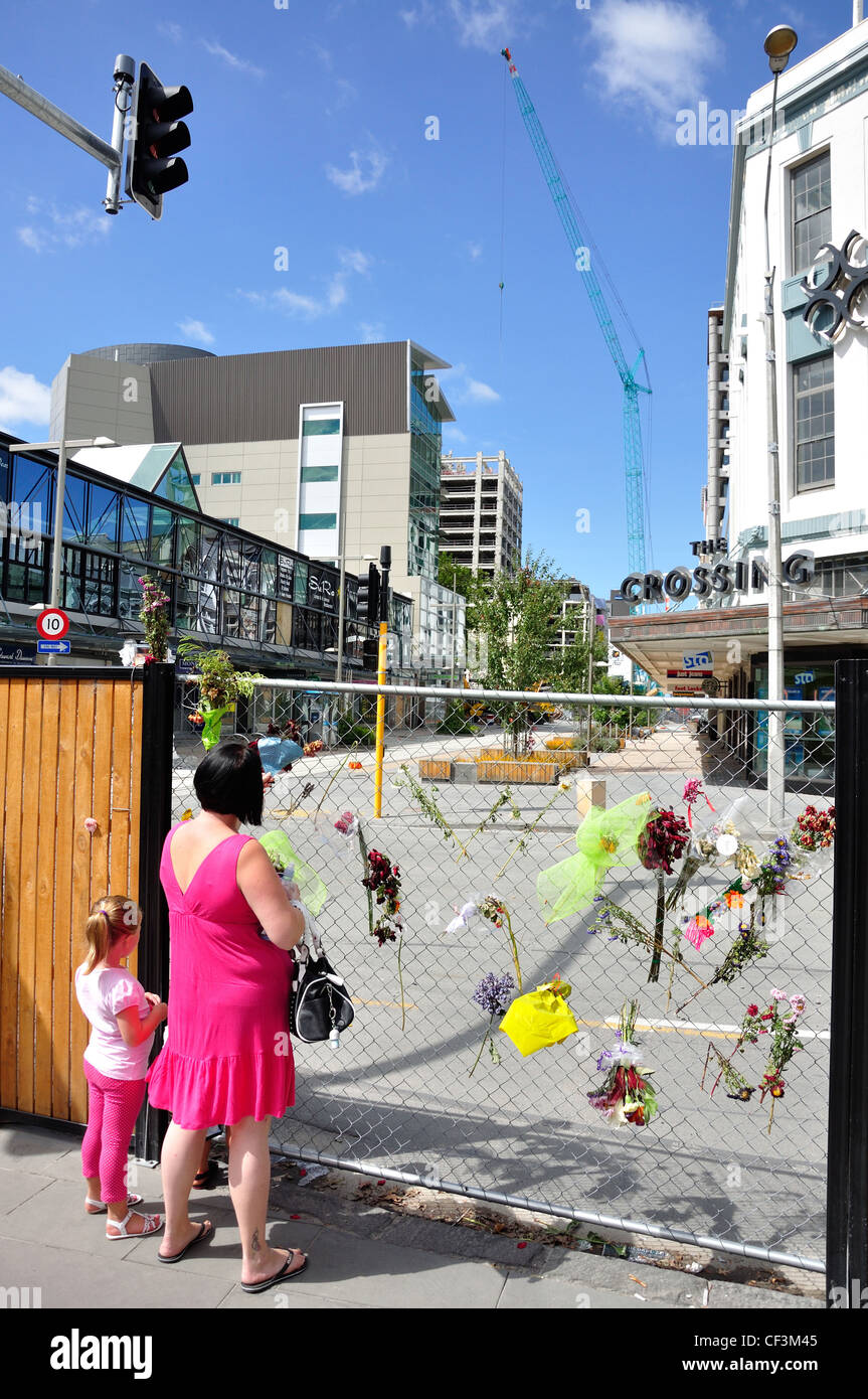 Flowers on fenced off C.B.D after earthquakes, Cashel Mall, Christchurch, Canterbury District, New Zealand Stock Photo