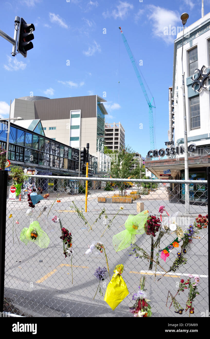 Flowers on fenced off C.B.D after earthquakes, Cashel Mall, Christchurch, Canterbury District, New Zealand Stock Photo