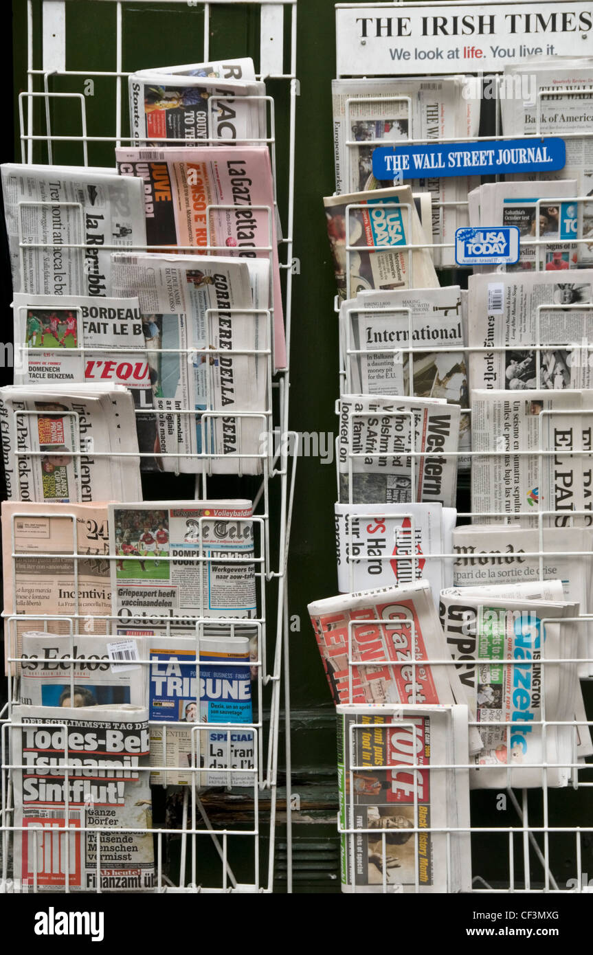 A selection of international newspapers on sale from a stand in Fleet Street. Stock Photo