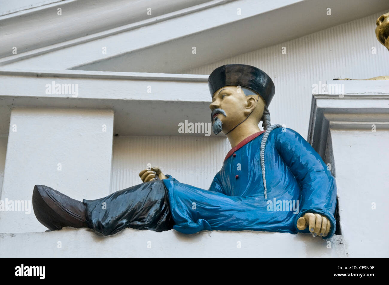 An Asian figure above the doorway to Twinings teashop, still at its original location on the Strand since it was first opened as Stock Photo