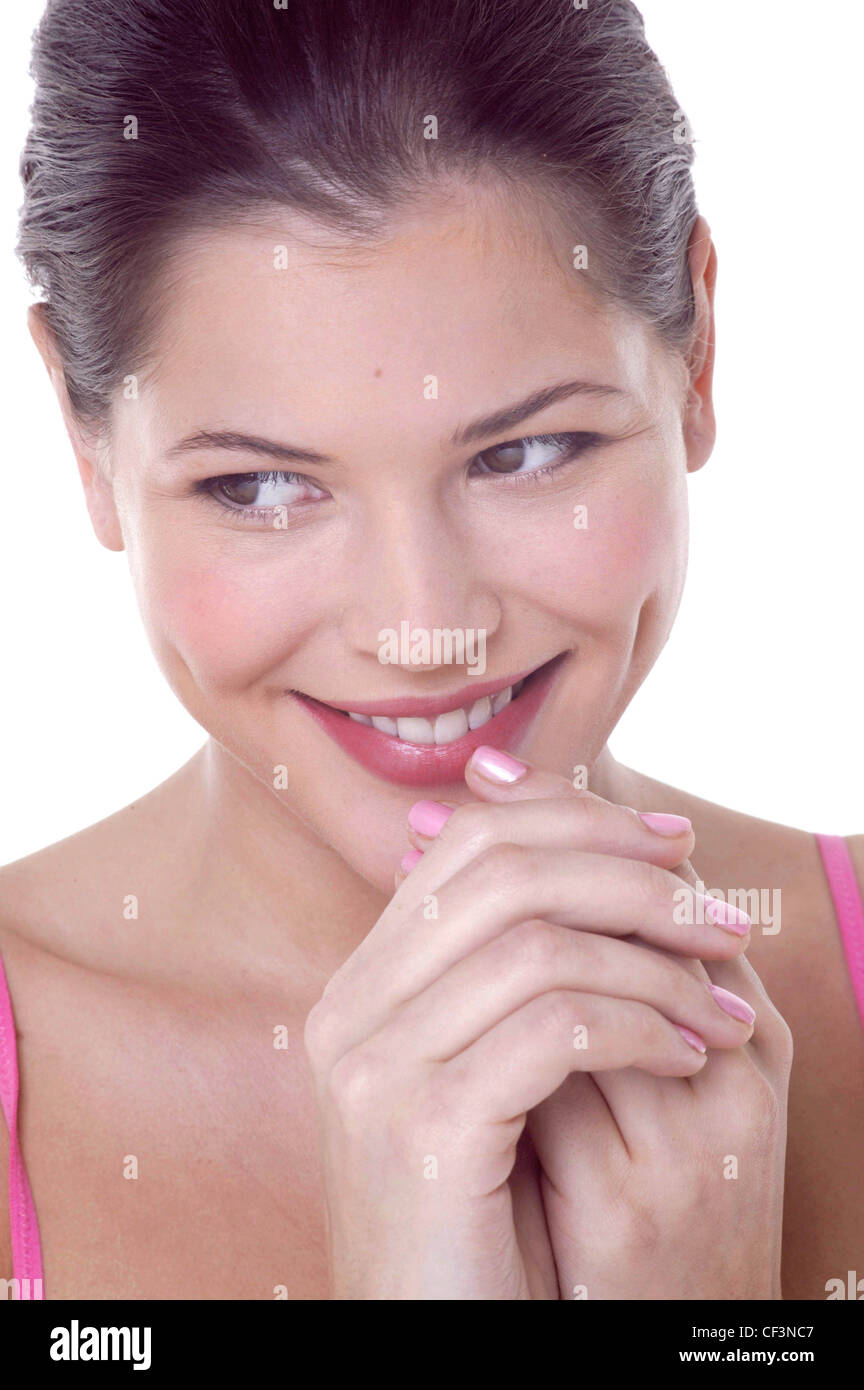 Female hair off face pink nail polish wearing pink vest top