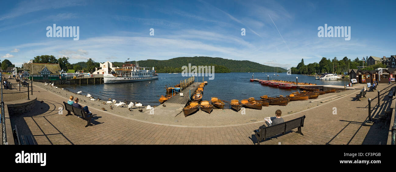 Panoramic view of rowing boats and pleasure craft on the waterfront at Bowness-on-Windermere. Stock Photo