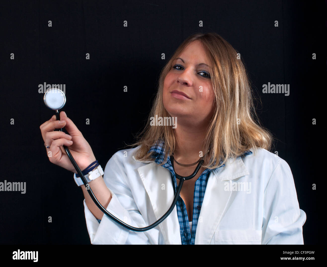 Young female doctor with stethoscope Stock Photo - Alamy