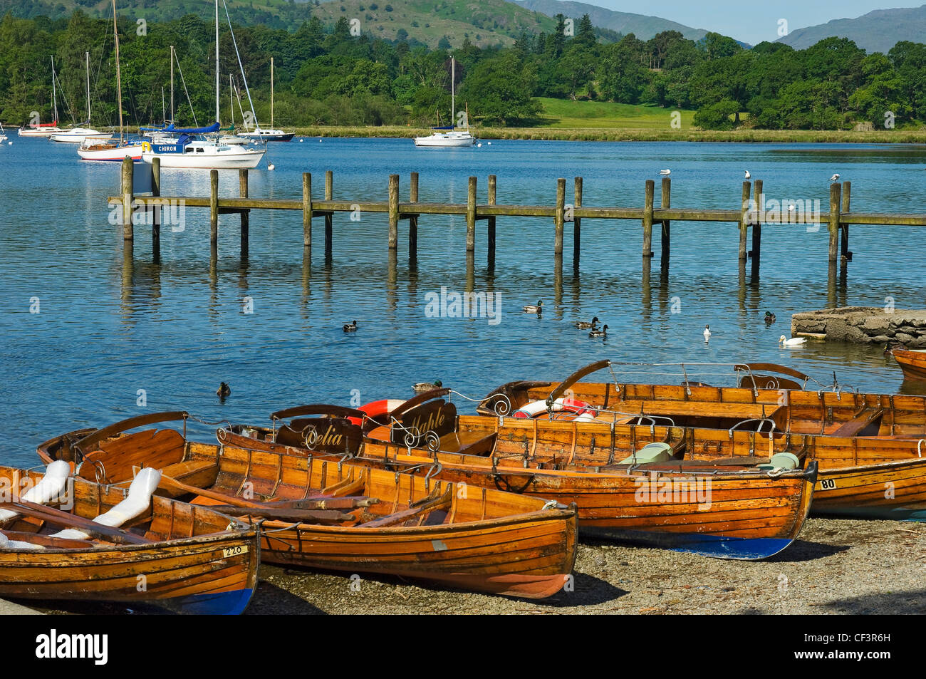 Rowing boats for hire on the shore of Lake Windermere in Ambleside. Stock Photo