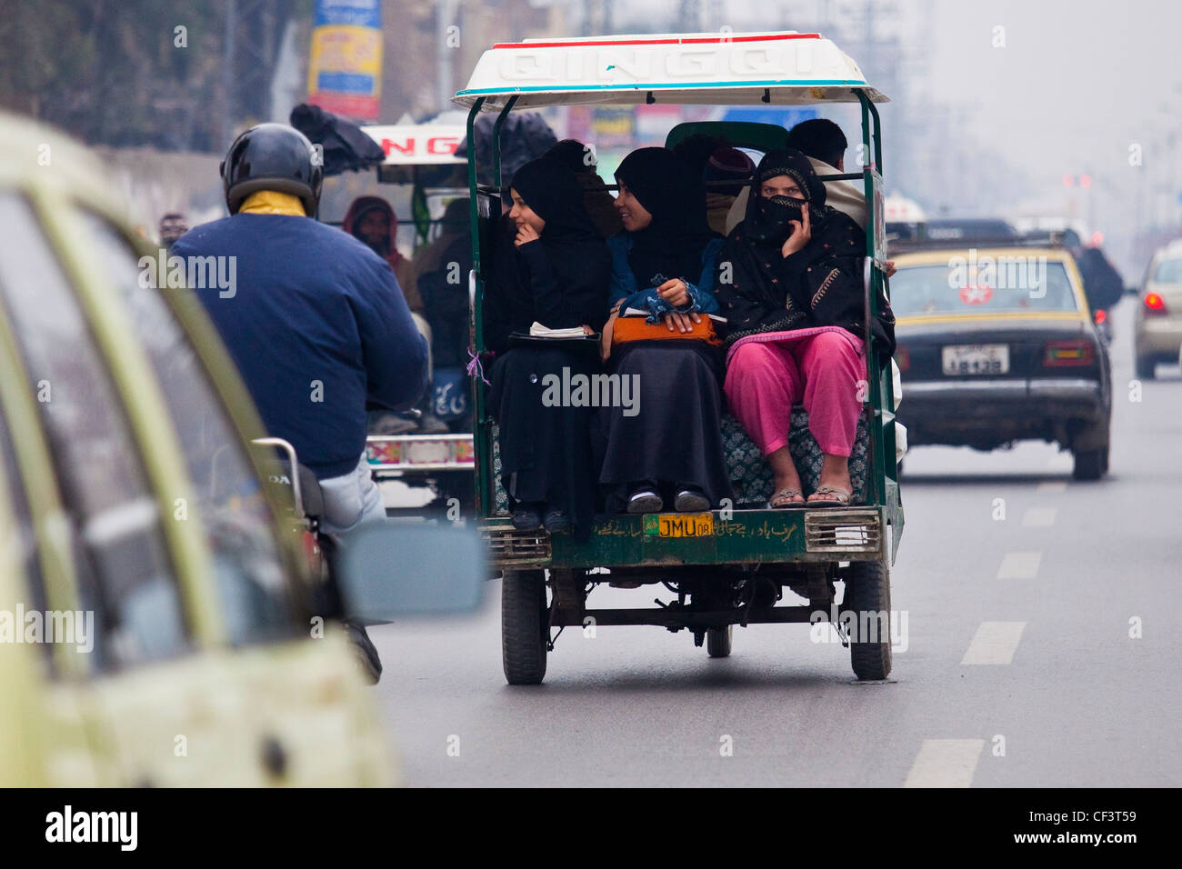 Traffic, women in a rickshaw, Rawalpindi, Pakistan Stock Photo - Alamy