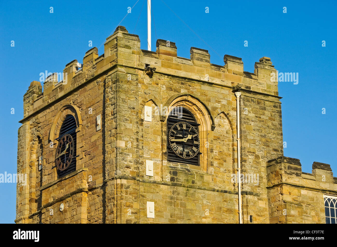Clock tower of St Mary's Church, the parish church of Whitby at the top of the 199 steps that lead up the hill from Whitby harbo Stock Photo