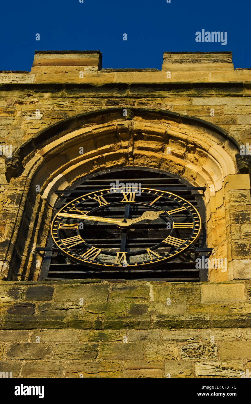 The clock face on the clock tower of St Mary's Church, the parish church of Whitby at the top of the 199 steps that lead up the Stock Photo