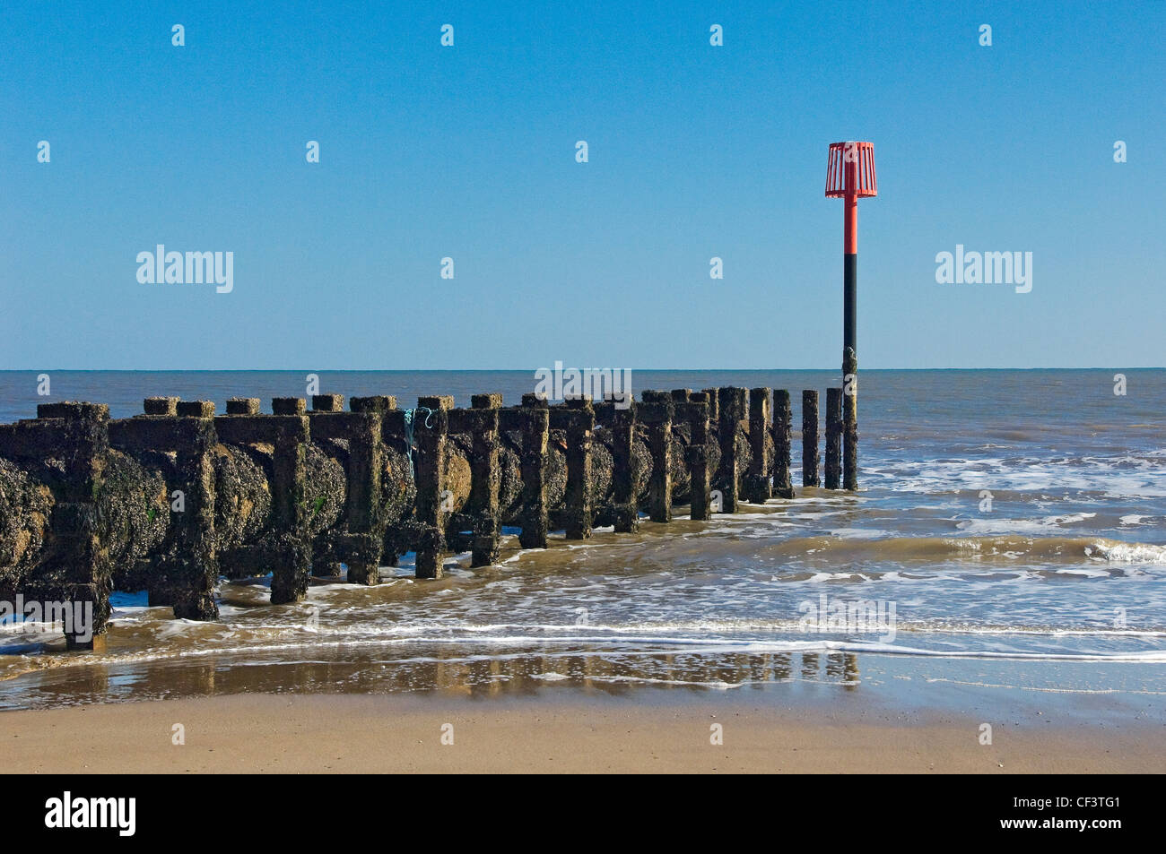 Warning mast on the beach Stock Photo