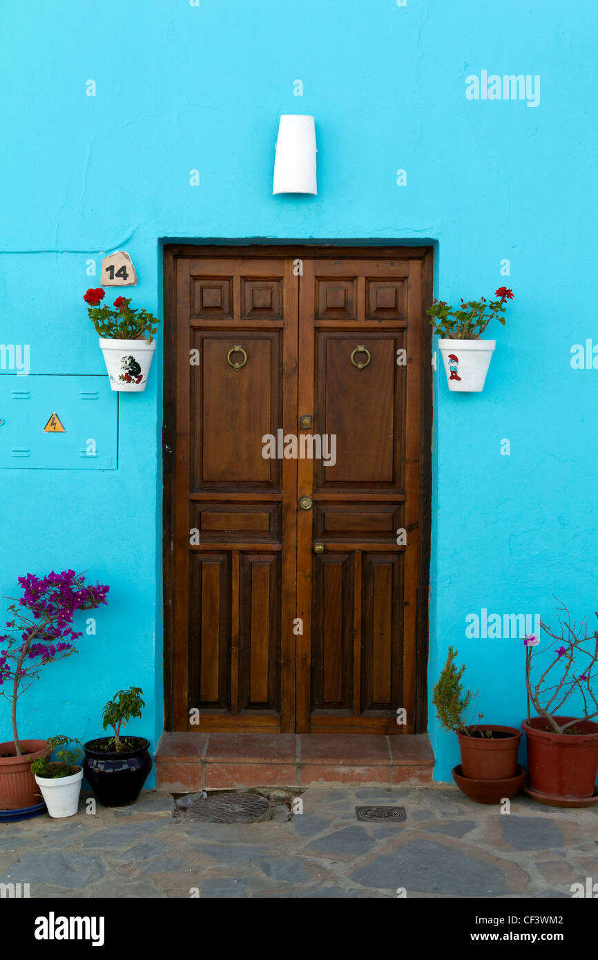 JUZCAR, SPAIN - CIRCA JUNE 2011: Door decorated with Smurfs pictures circa June 2011 in Malaga, Spain. Stock Photo