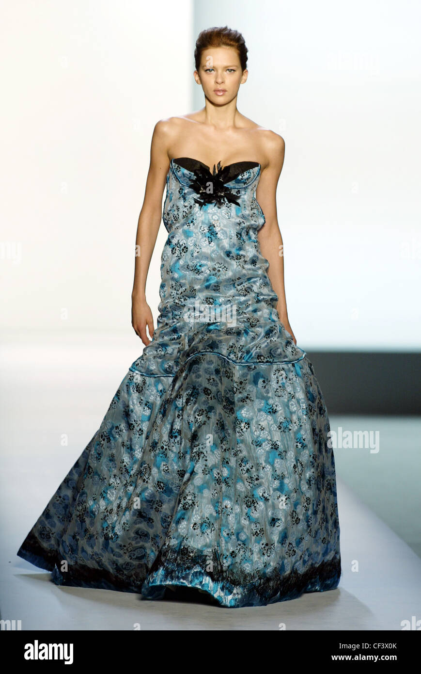 Rochas Paris Ready to Wear Spring Summer Model red hair off face wearing blue and black printed satin flolength strapless Stock Photo - Alamy Rochas Paris Ready to Wear Spring Summer Model red hair off face wearing blue and black printed satin flolength strapless Stock Photo - Alamy