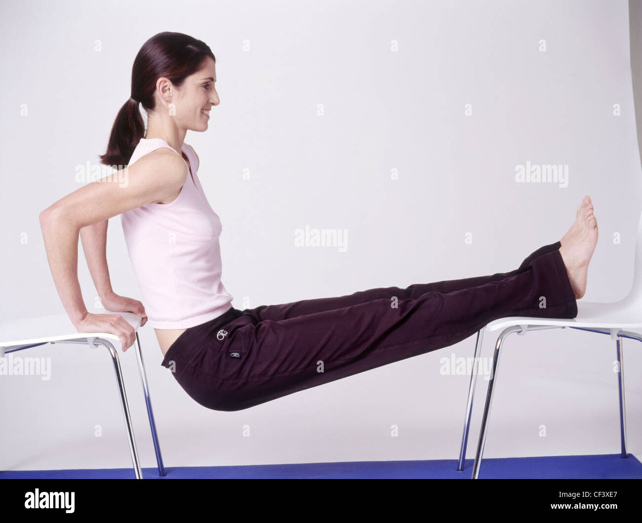 "Eight of the bestarms" Seated triceps dips, female balancing between