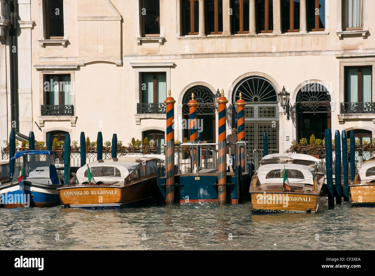 Motor boats moored in front of Palazzo Morosini, on the Grand Canal - Venice, Venezia, Italy, Europe Stock Photo