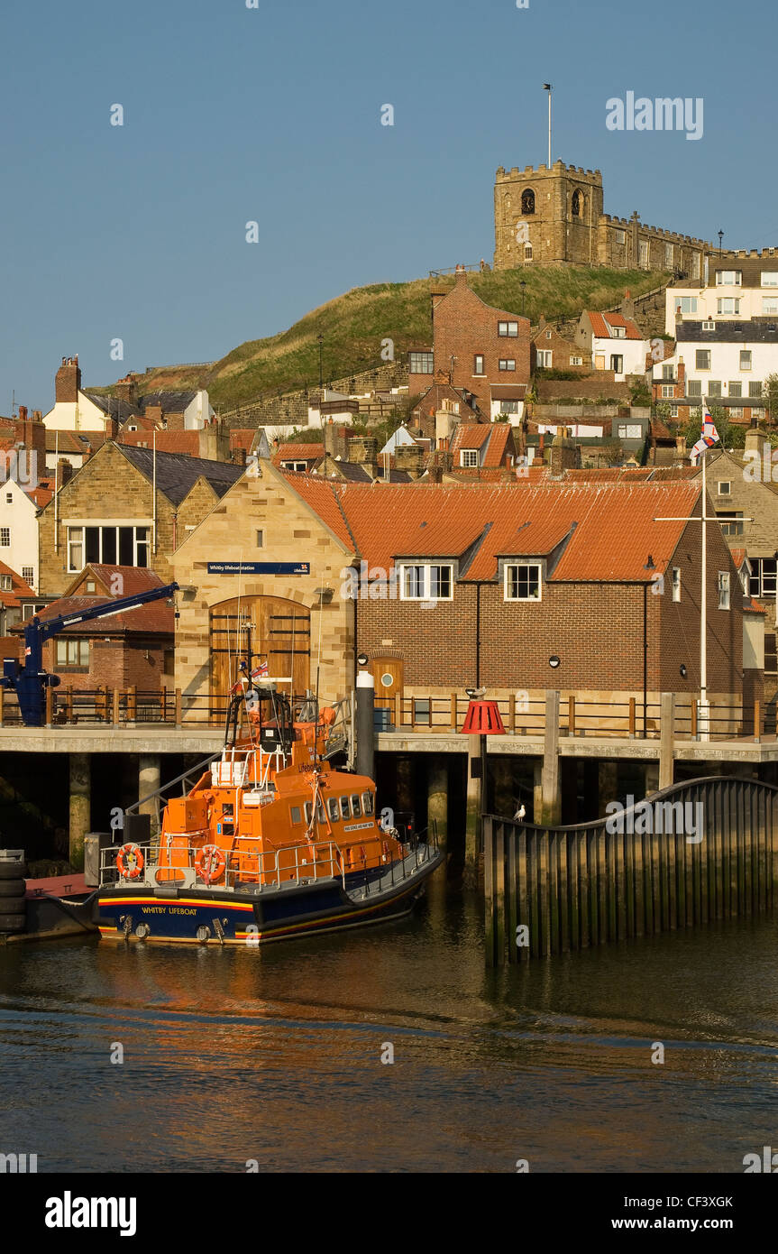 The RNLI lifeboat George and Mary Webb moored outside the lifeboat station in Whitby Harbour. Stock Photo