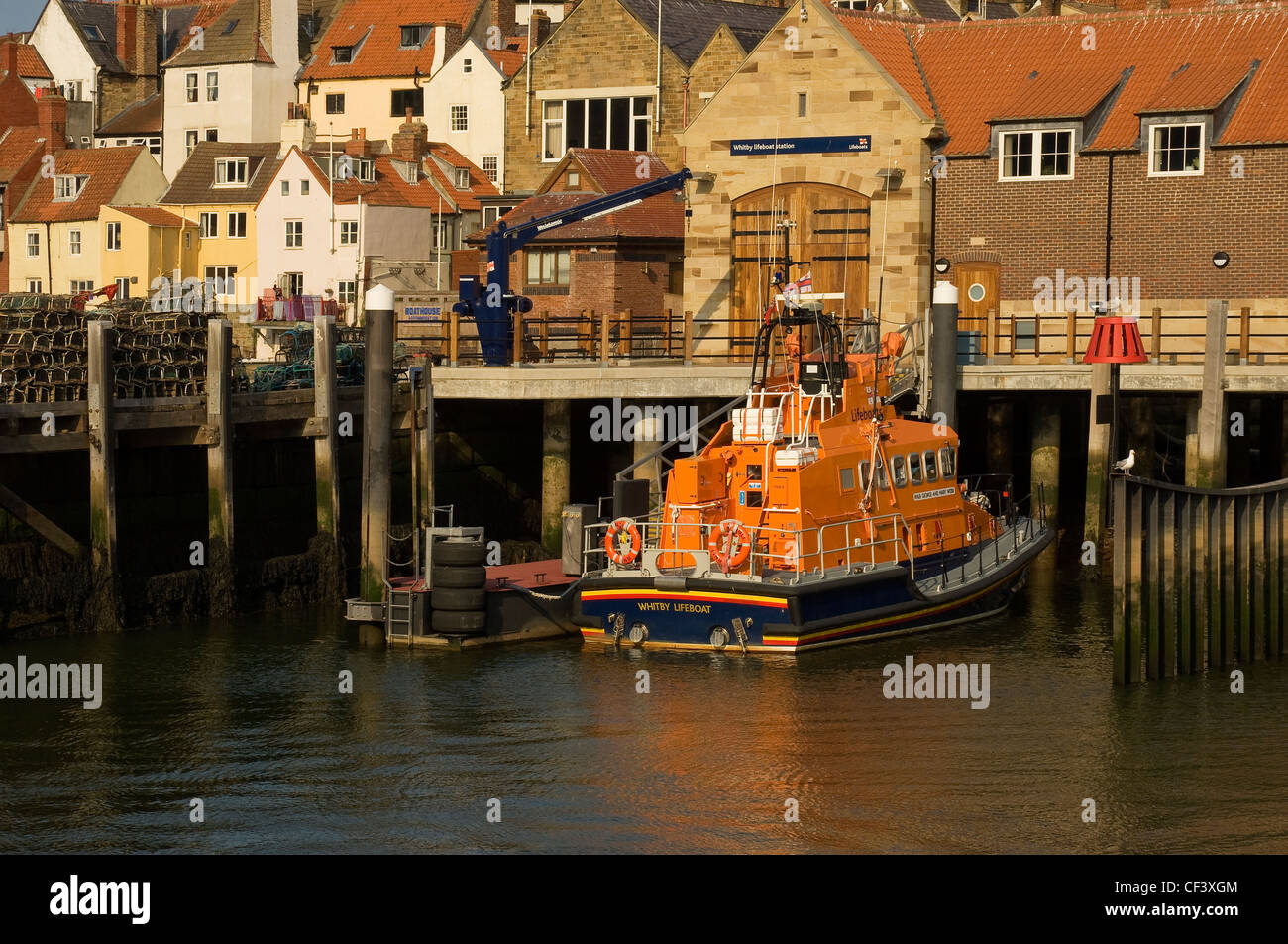 The RNLI lifeboat George and Mary Webb moored outside the lifeboat station in Whitby Harbour. Stock Photo