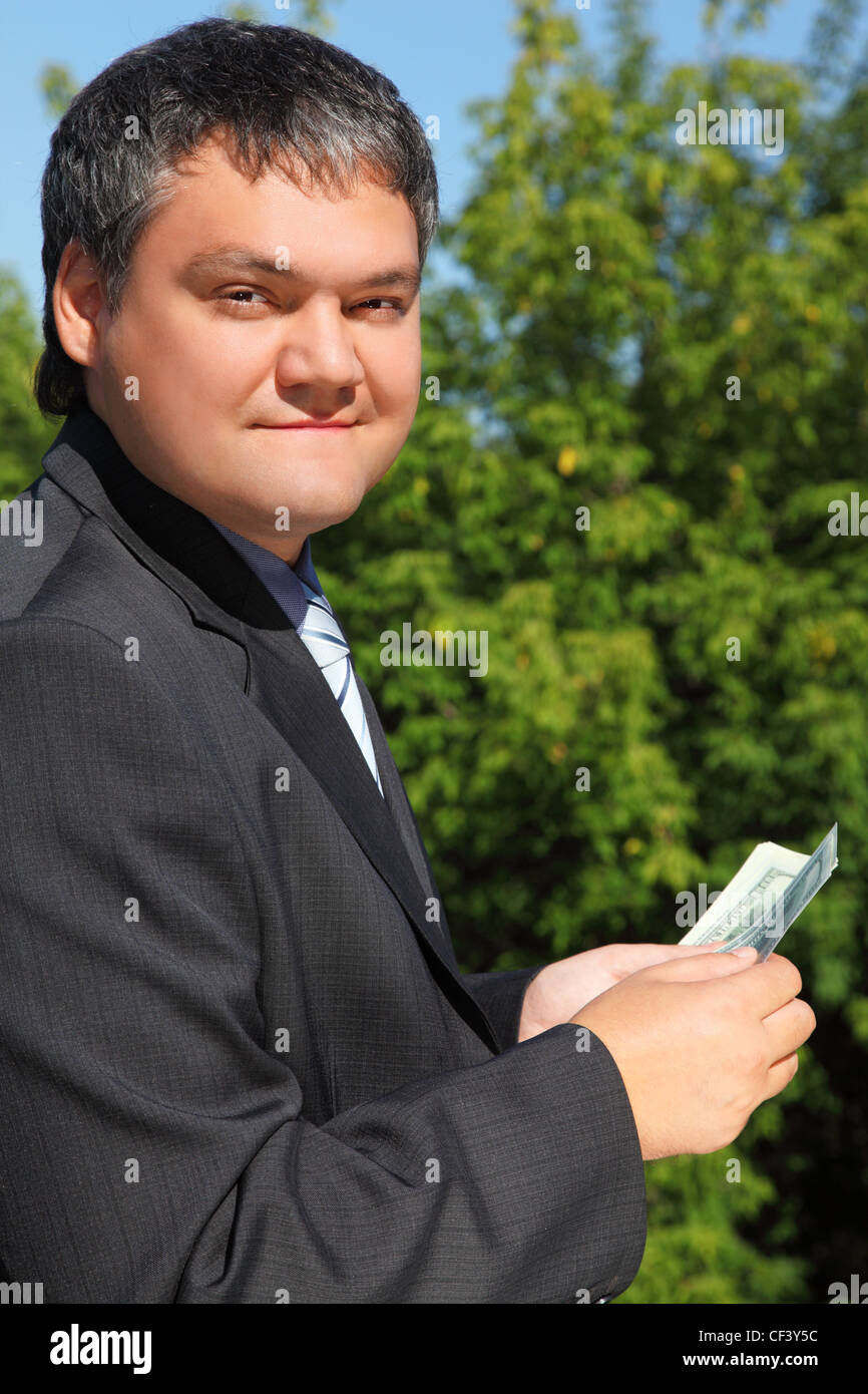 businessman counting money outdoor in summer Stock Photo - Alamy