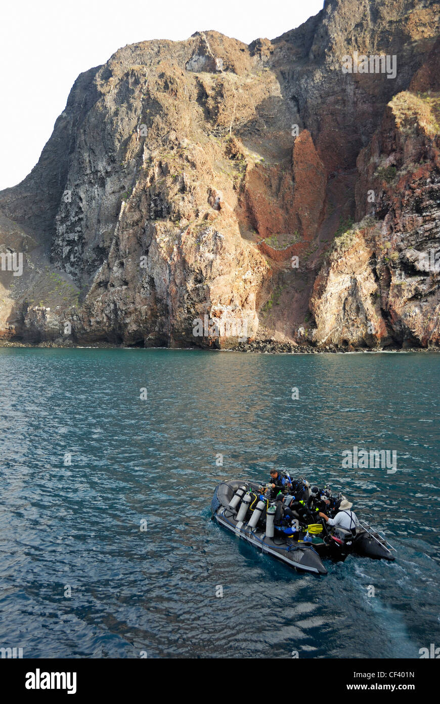 Scuba divers in a inflatable raft by Isabella island, Galapagos Islands ...