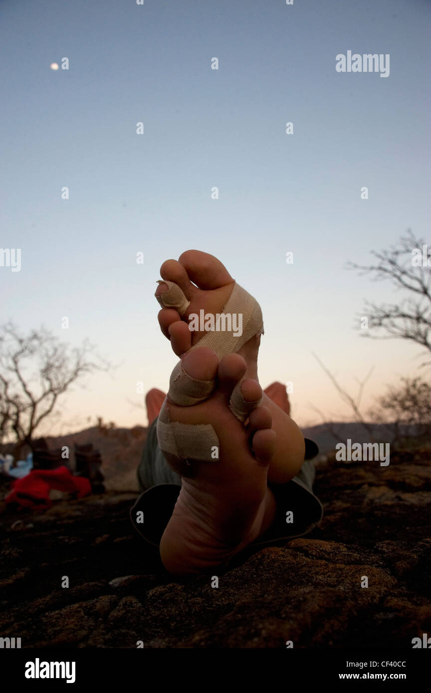 A hikers rest her weary feet after a day of walking Stock Photo Alamy