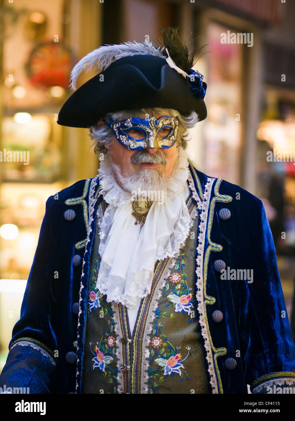 A man wearing a carnival mask and costume in San Marco district