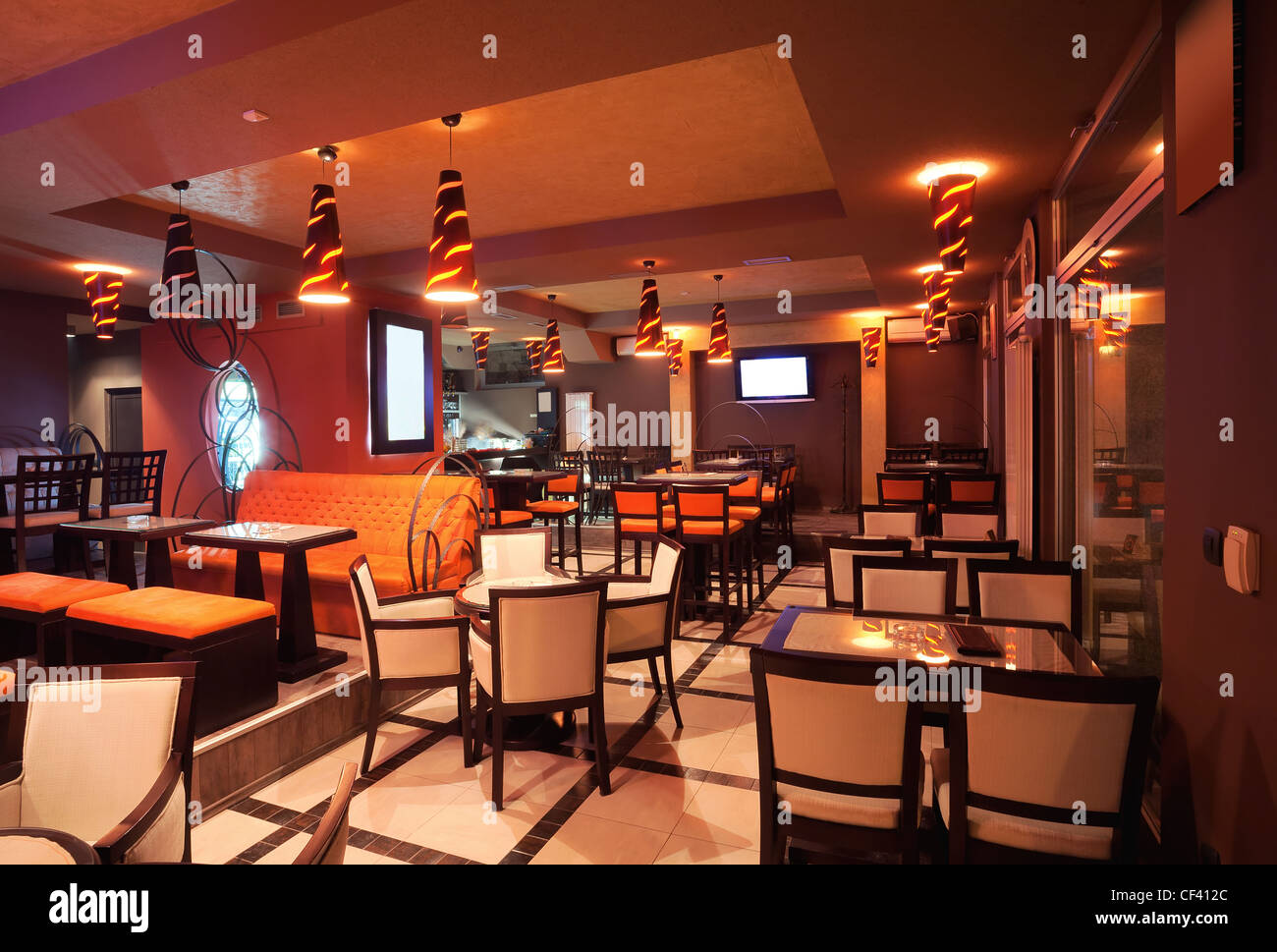 Interior of a restaurant, modern design in few colors, orange and brown