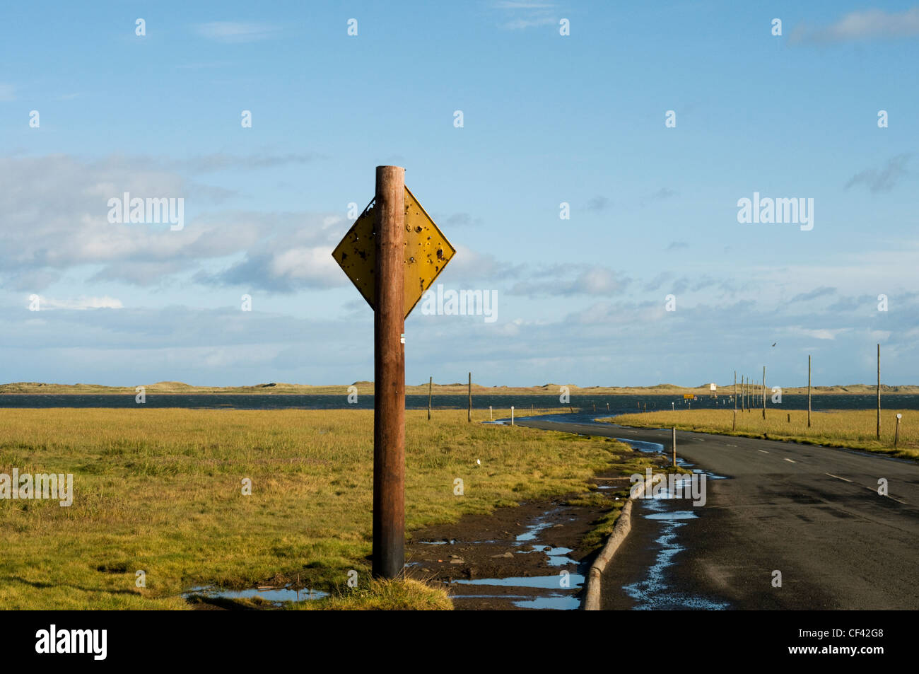 A view along the Lindisfarne Causeway at low tide. Stock Photo
