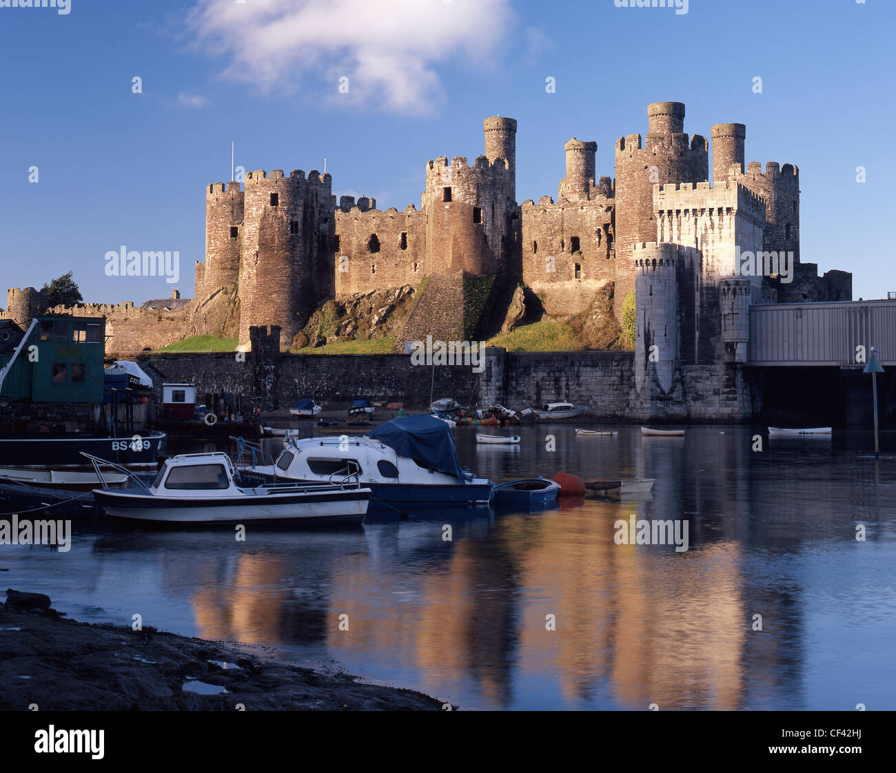 Small boats moored on the River Conwy by Conwy Castle, constructed by the English monarch Edward I between 1283 and 1289 as one Stock Photo