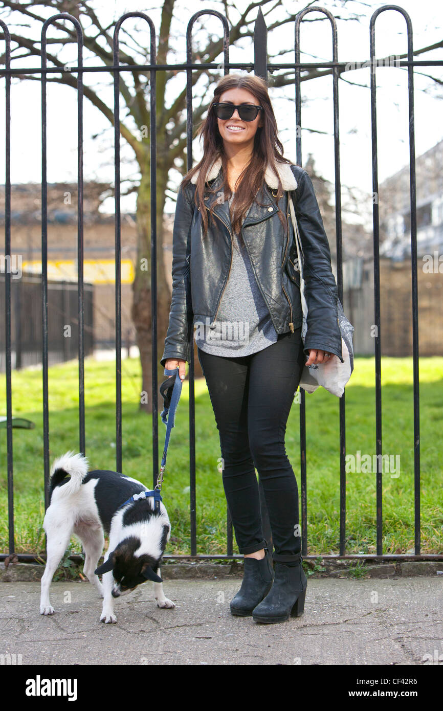 Full length portrait of a pet owner woman standing, London, England, UK Stock Photo