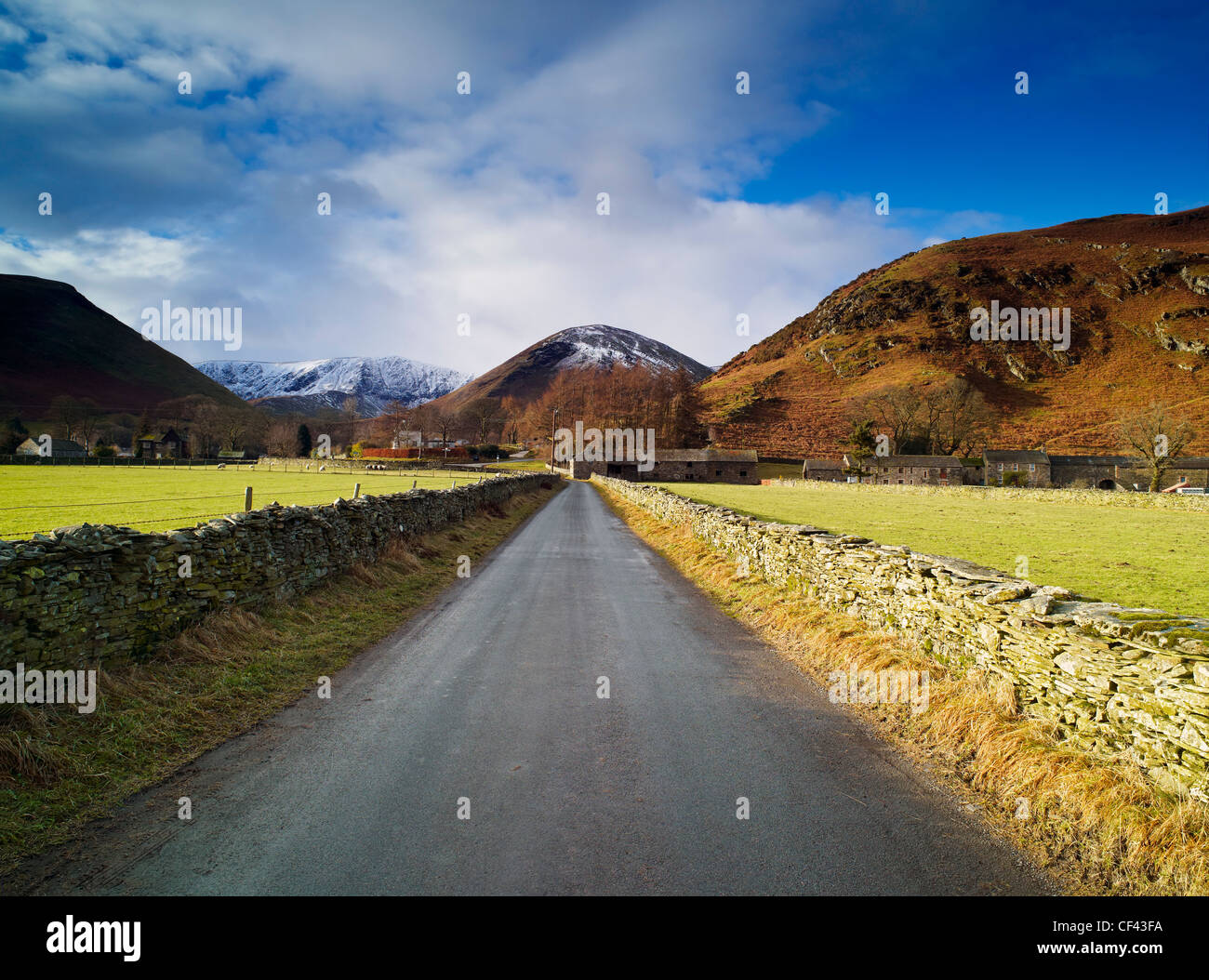 Looking along a quiet lane towards the remote Cumbrian village of Mungrisdale in the Lake District. Stock Photo