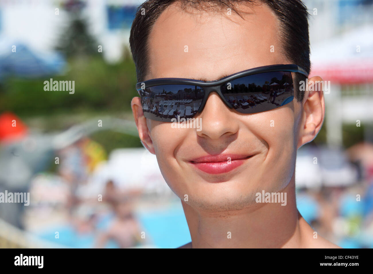 smiling young man in sunglasses in aquapark Stock Photo - Alamy