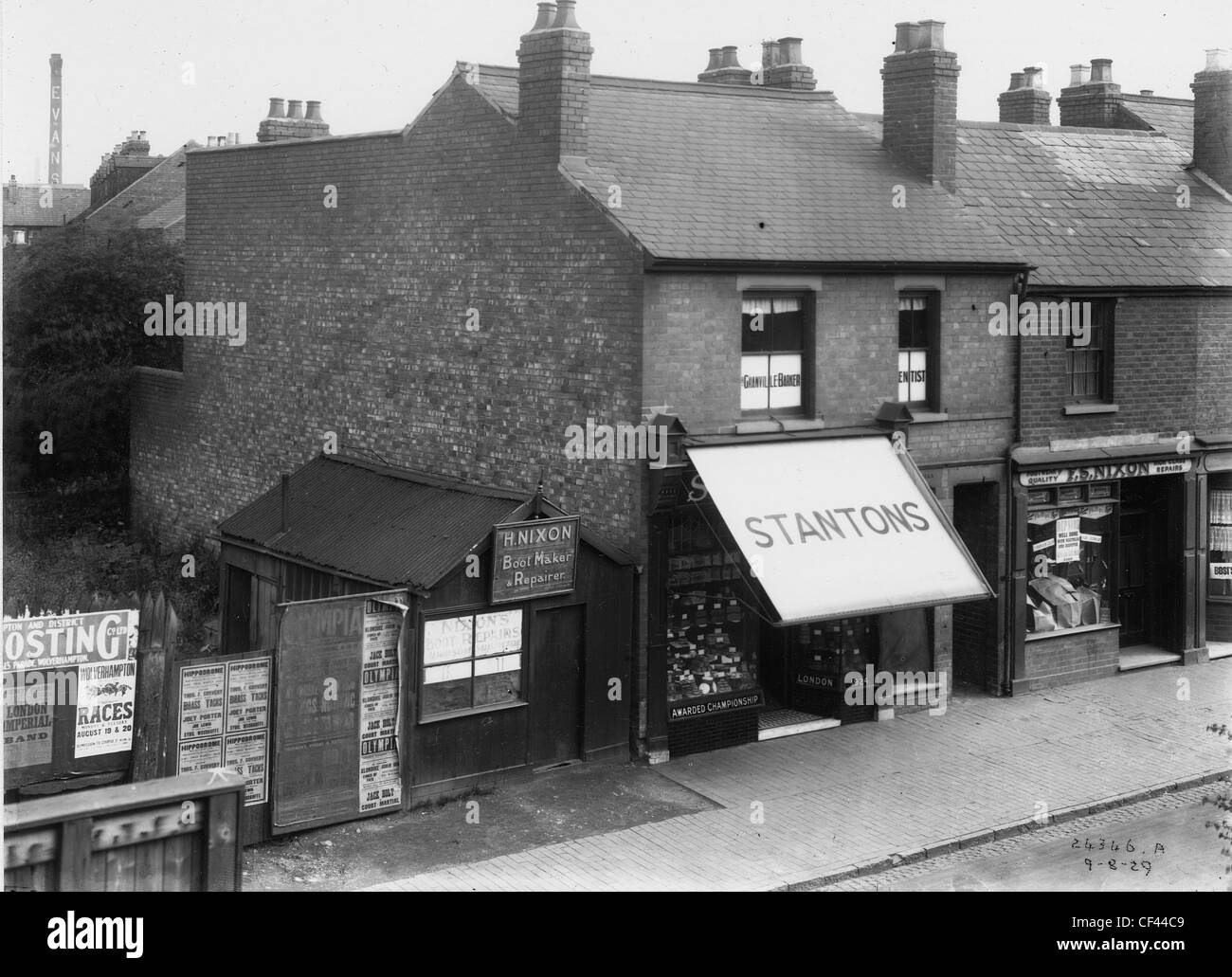 Shops in Market Street, Wolverhampton 1929. Shops include a boot maker and repairer; a shoe repairer, and a dentist. Stock Photo