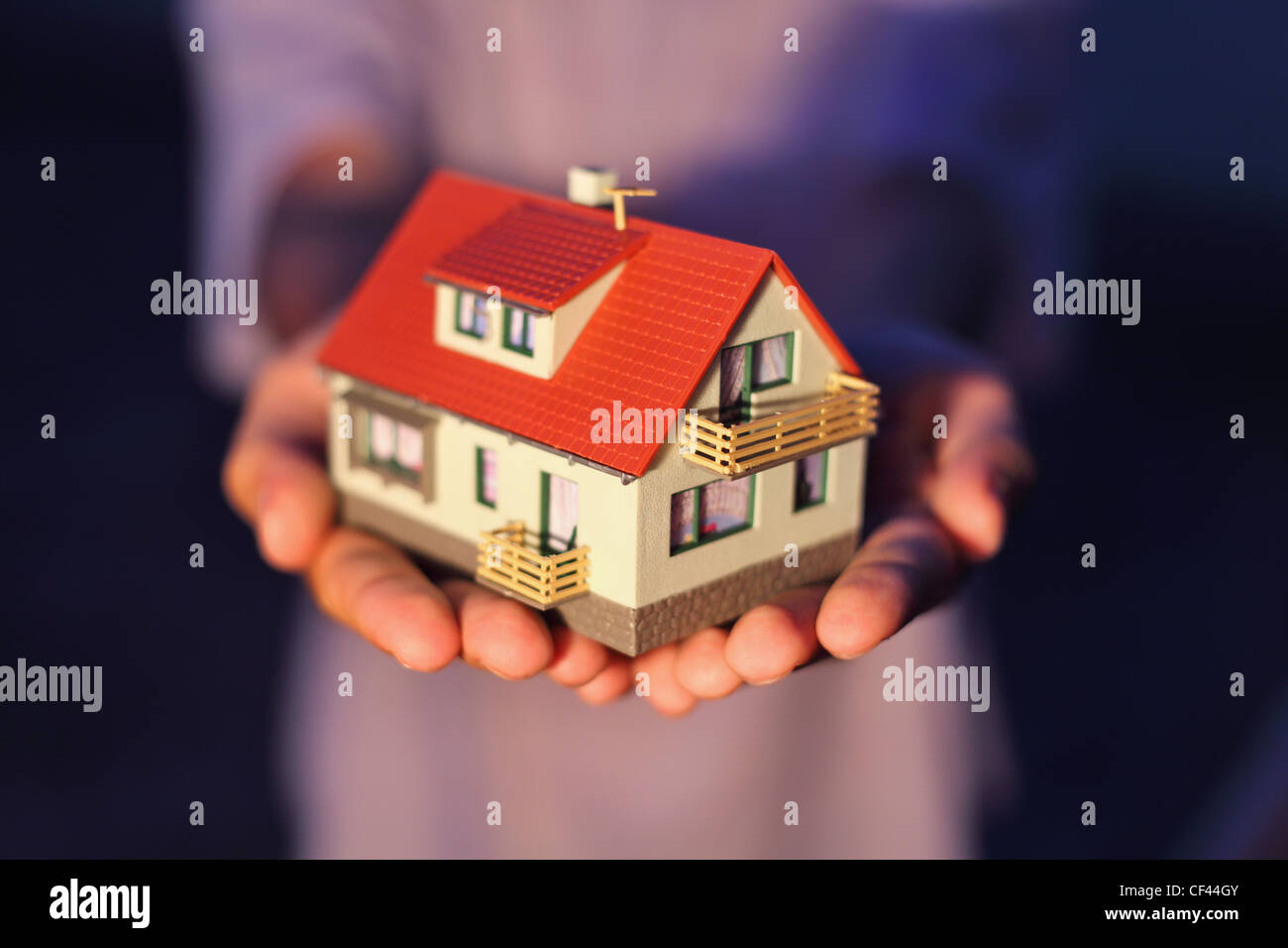 model of house on hands Stock Photo