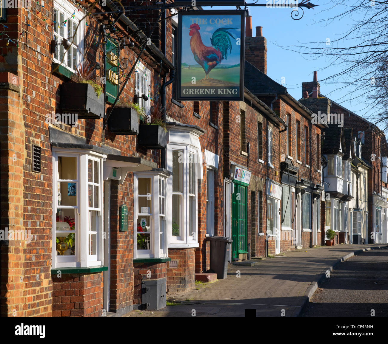 The Cock Tavern and shops in Baldock High Street. Baldock is thought