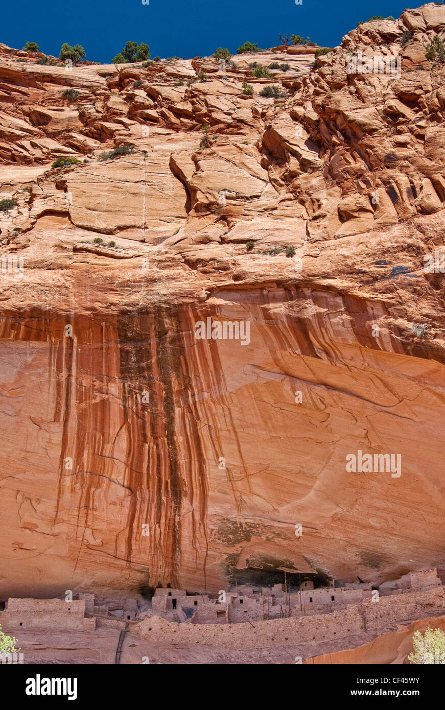 Desert varnish on Skeleton Mesa cliff over Keet Seel ruins at Navajo National Monument, Shonto