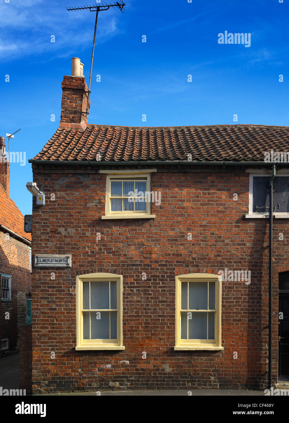 Exterior of a redbrick terraced cottage in Grantham. This is typical of old terraced mid-England worker's cottages found in many Stock Photo