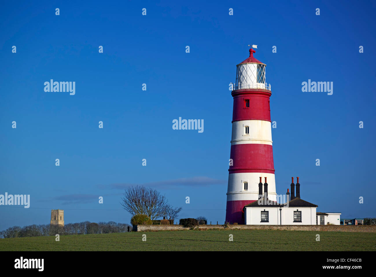 A view toward Happisburgh Lighthouse. It is the oldest working light in East Anglia and the only independently run lighthouse in Stock Photo