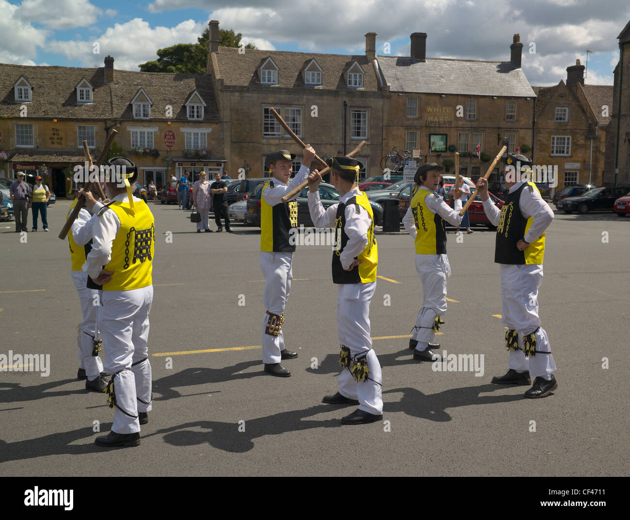 The Westminster Morris Dancers in full flight in Stow on the Wold. Stock Photo